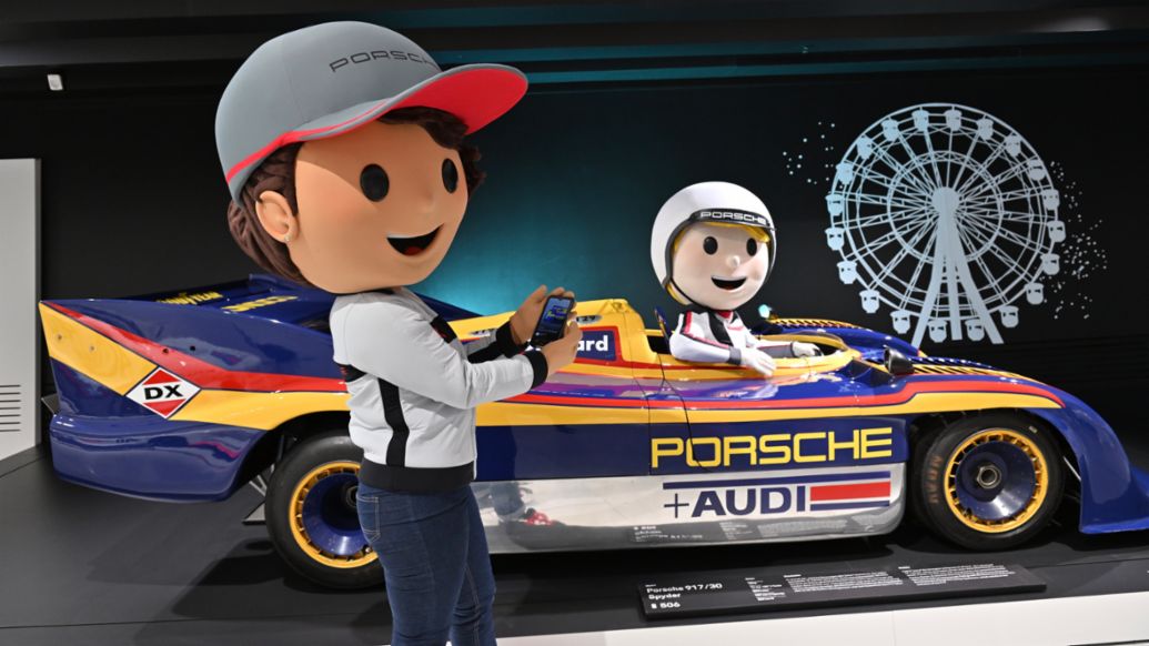 At the summer holiday program, children meet Tina Turbo and Tom Targa at the exhibition, 2023, Porsche AG