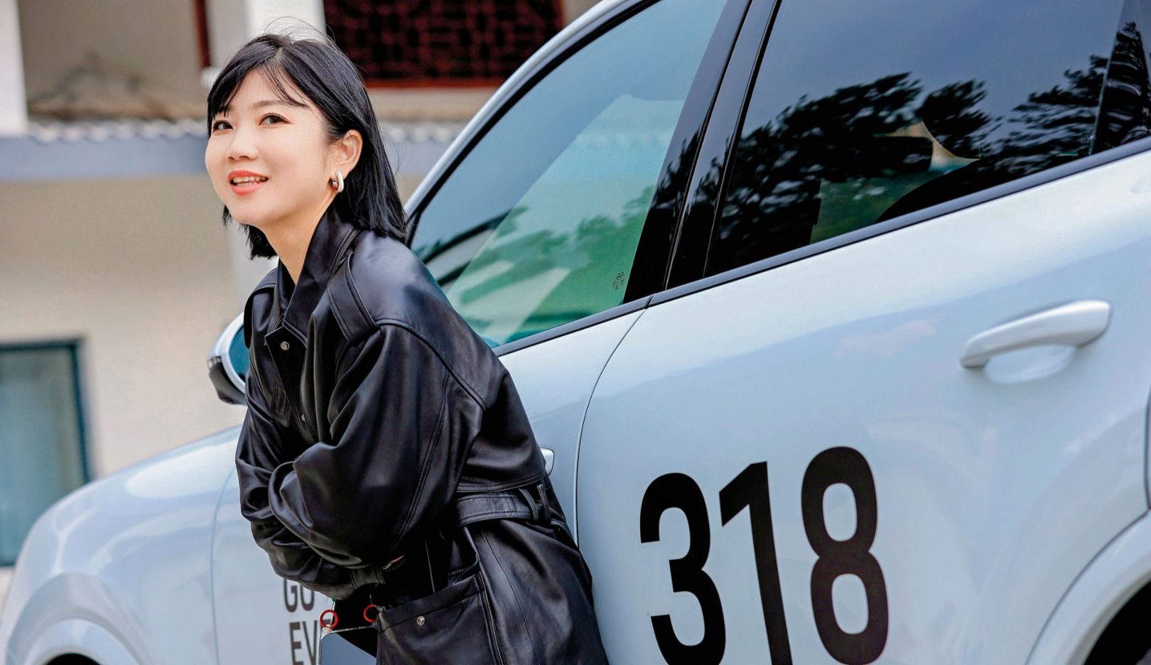 A question of design: Qiu Jie drives a 911 at home, but was thrilled to test the SUV models on the road trip. “For me, design is the top priority,” she says.
