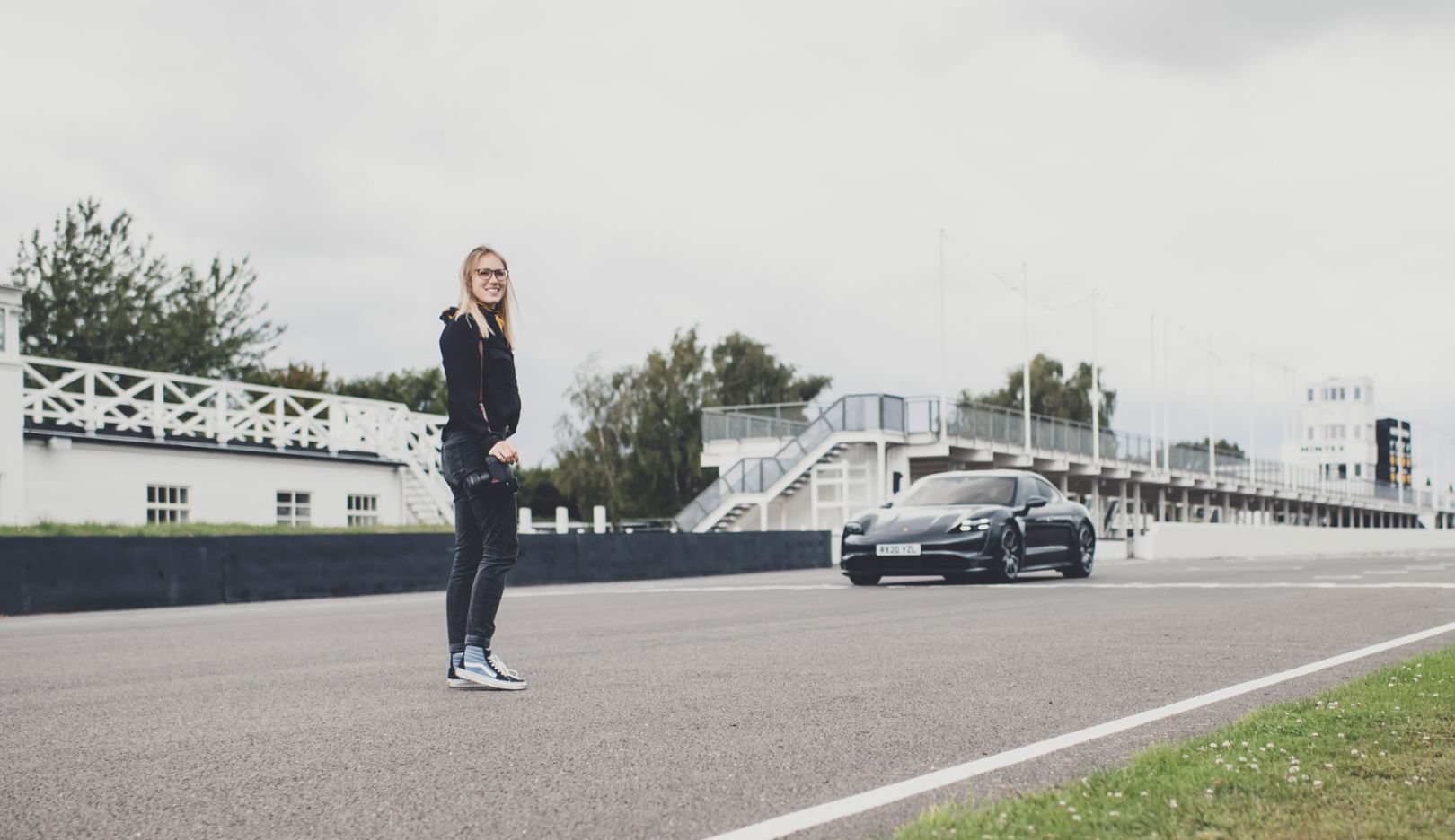 A photo of the photographer: Amy and “her” Taycan—a happy ending on the long straights of Goodwood.