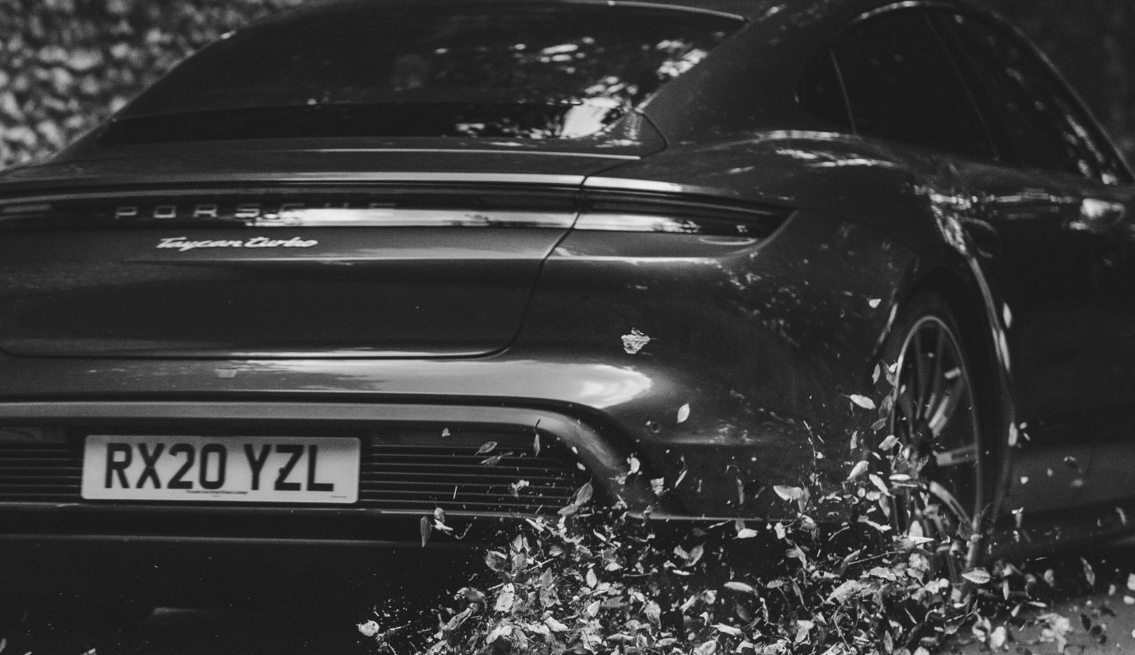 The sound of Goodwood is so different than usual. Only the rustling of leaves echoes from the wall—the all-electric Taycan blends into this silence.