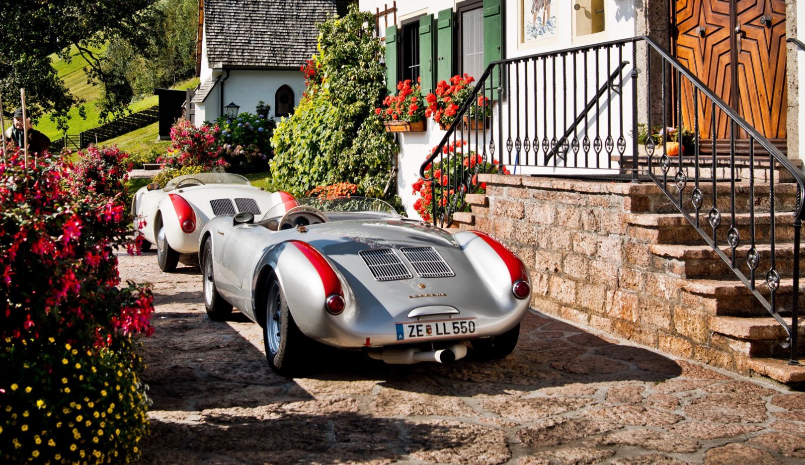 Two Porsche 550 Spyders; two examples of the brand's first true sports car; two classic cars in the idyllic Alps—fun to look at and even more fun to drive.