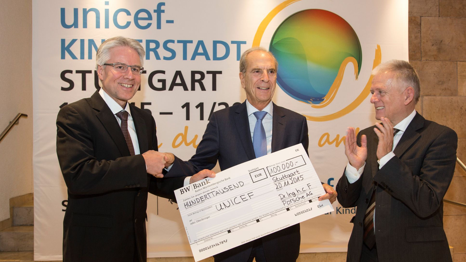 Andreas Haffner, Member of the Executive Board Human Resources, Dr. Jürgen Heraeus, Chairman UNICEF Germany, Fritz Kuhn, Mayor of Stuttgart (l.-r.), 2015, Porsche AG 