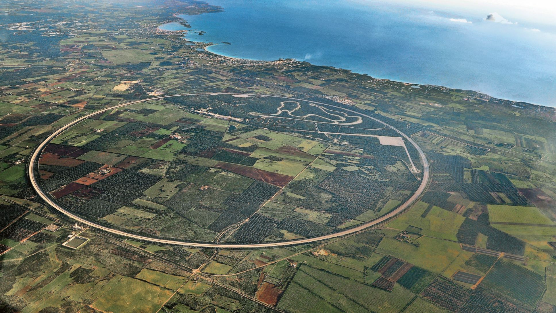 The Nardò Technical Center from above with the high-speed circular track that is unique worldwide with a length of 12.6 kilometres