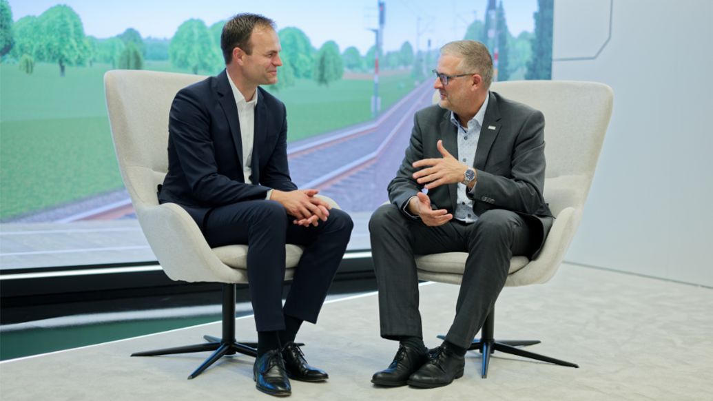 Simon Braun, Partner at Porsche Consulting, Markus Fritz, Vice President Markets Germany &amp; Global Account Manager Deutsche Bahn at Hitachi (l-r), 2025, Porsche Consulting GmbH