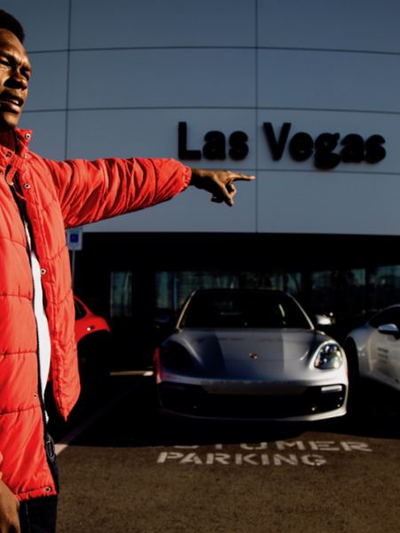 UFC champion Israel Adesanya surveys the lot and available Porsche Passport fleet at Gaudin Porsche of Las Vegas, 2020, Photo: Jeff Sainlar