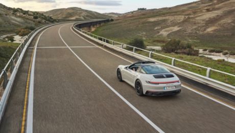 Porsche AG continues positive business development in first half-year 