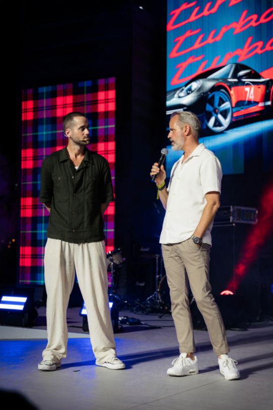 Frank Moser, Vice President for 911 and 718 Model Lines, Porsche AG with the Taycan GTS at Icons of Porsche 2024 in Dubai