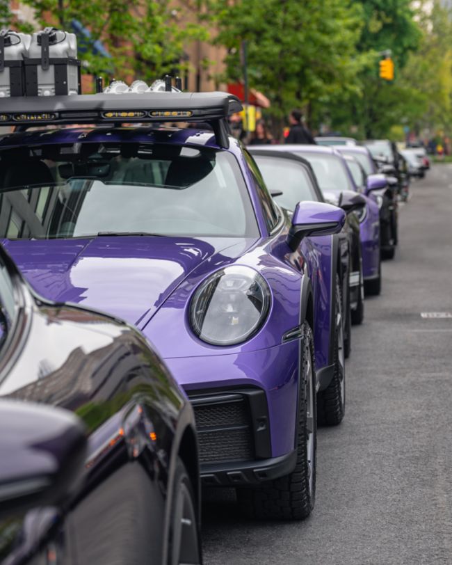 A parade of rare Porsches paints the streets of NYC purple