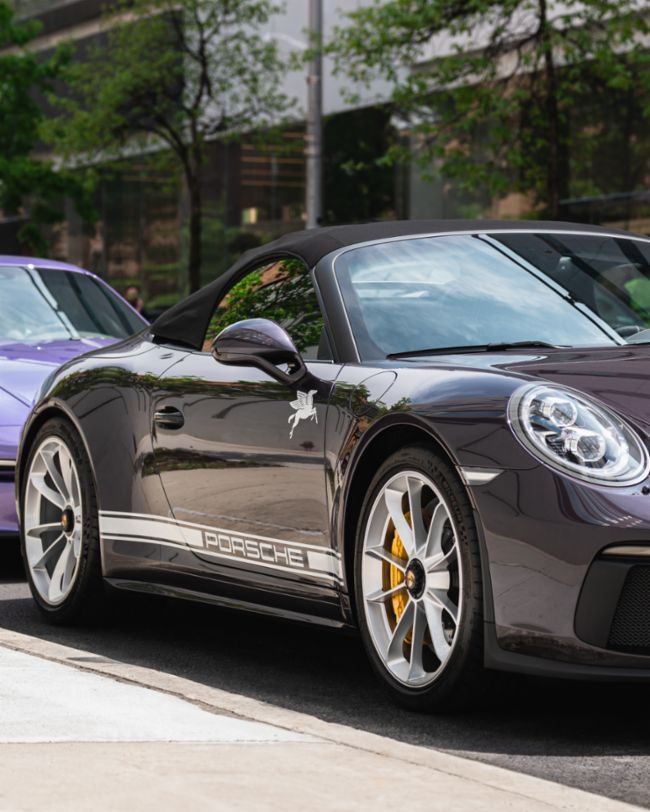 A parade of rare Porsches paints the streets of NYC purple