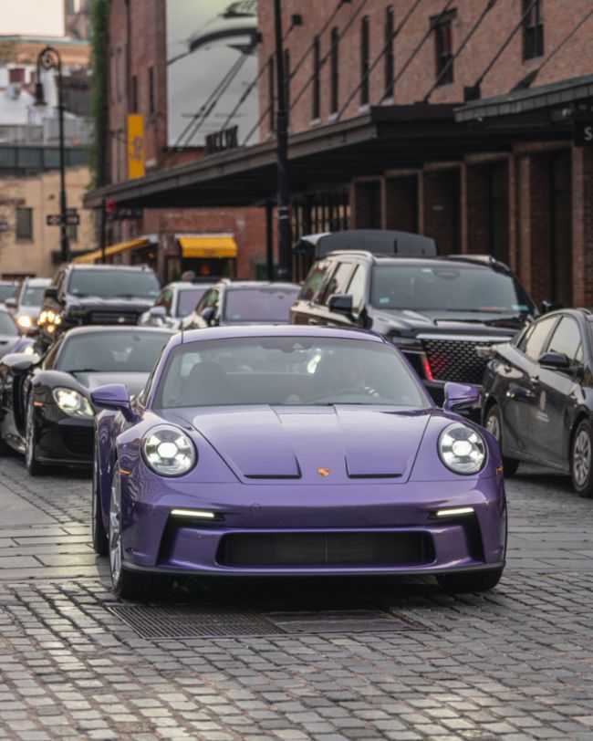 A parade of rare Porsches paints the streets of NYC purple