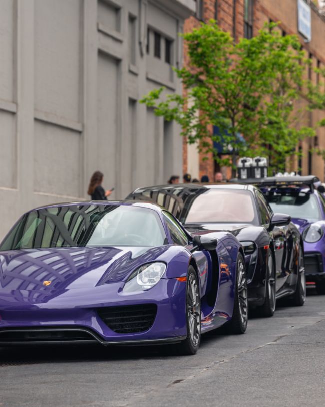A parade of rare Porsches paints the streets of NYC purple