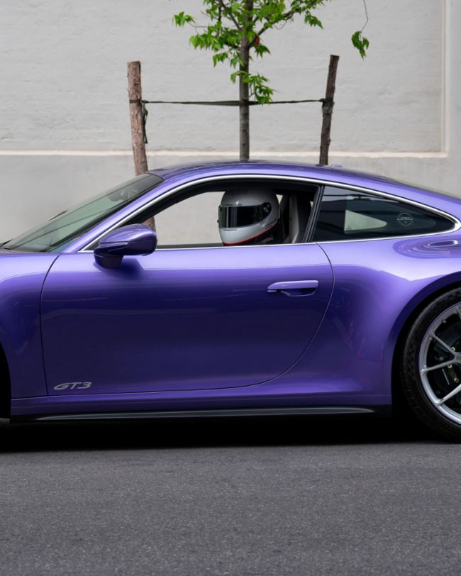 A parade of rare Porsches paints the streets of NYC purple