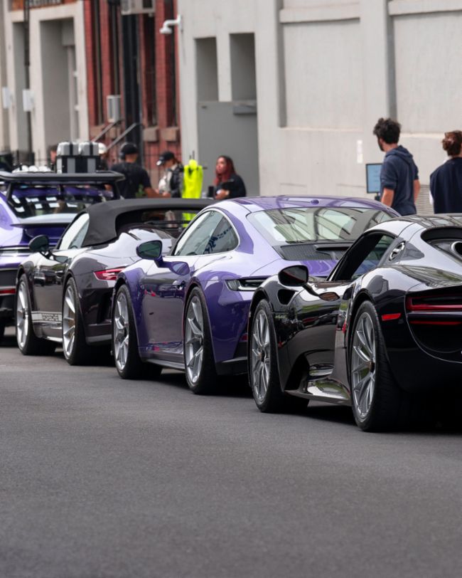 A parade of rare Porsches paints the streets of NYC purple