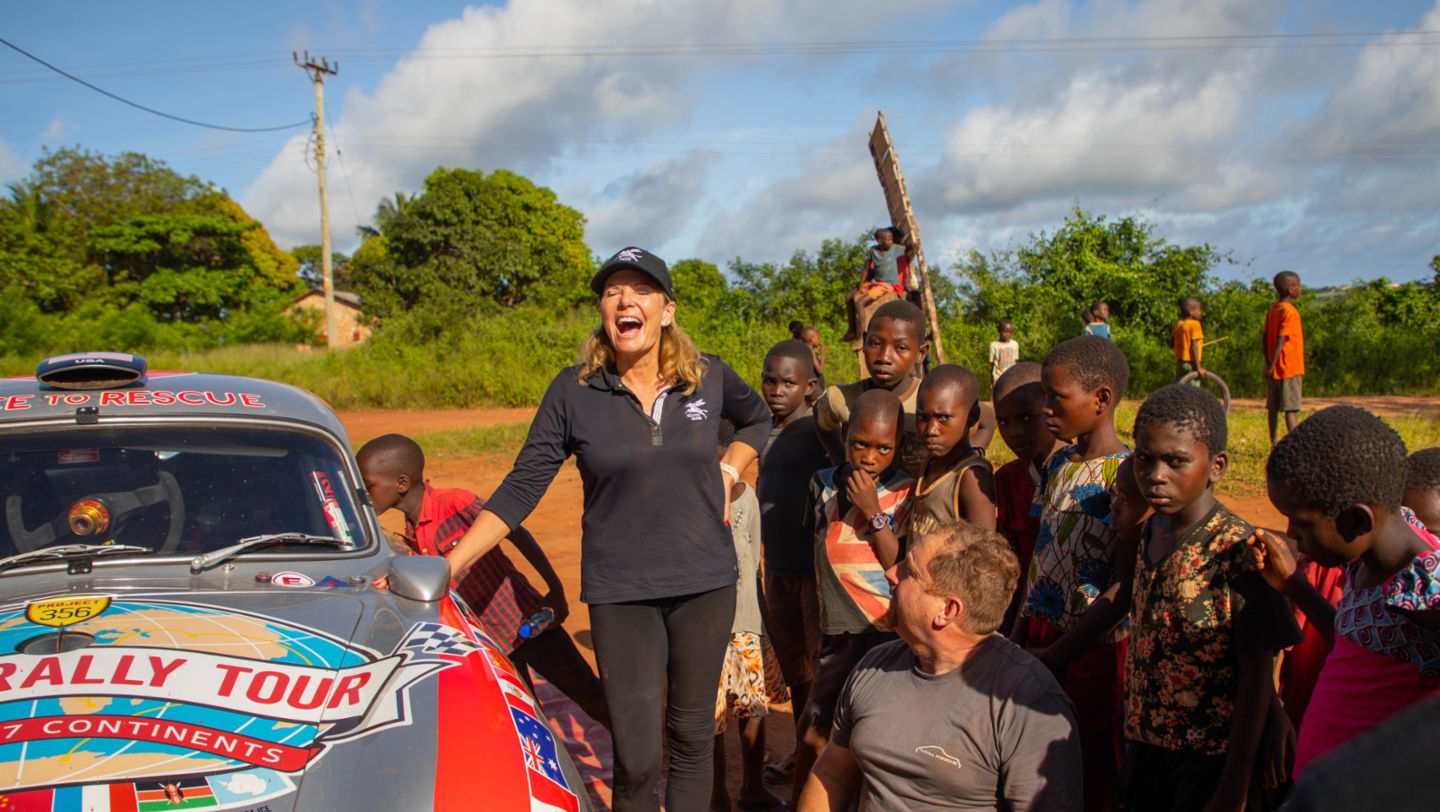 Just outside of Mombasa, Kenya, Renee Brinkerhoff stops to get to know local children of the Kilifi County area during road testing for the 2019 East African Safari Classic Rally., Photo: Christina Brinkerhoff