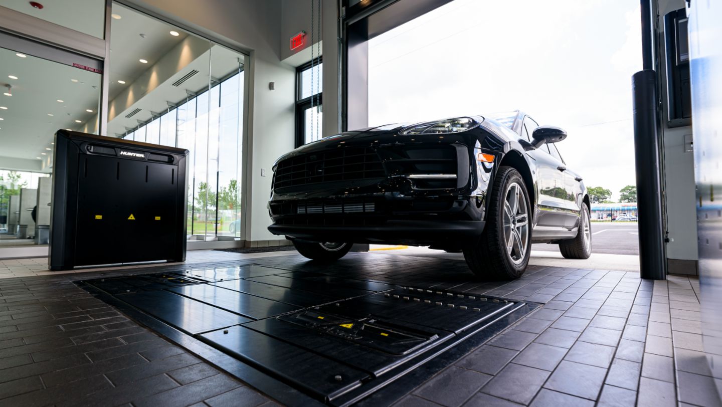 Customers have alignment and tire tread checked when arriving for service appointment at Porsche Service Center South Atlanta, 2021, PCNA