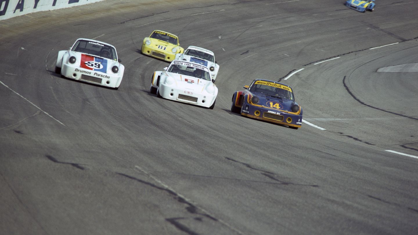 Al Holbert races on the banks of Daytona (blue No. 14) Porsche 911 RSR, 1974, PCNA