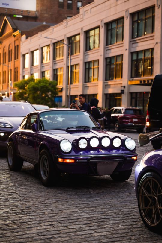 A parade of rare Porsches paints the streets of NYC purple
